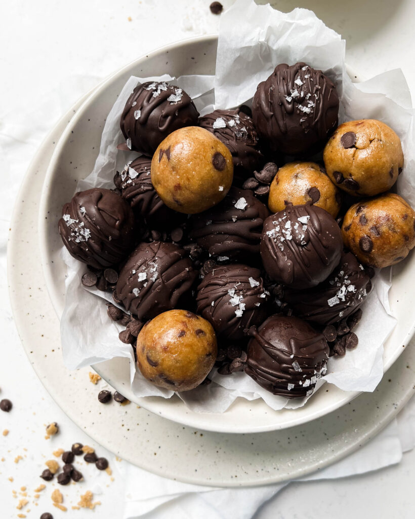 cookie dough in a white bowl on a linen cloth