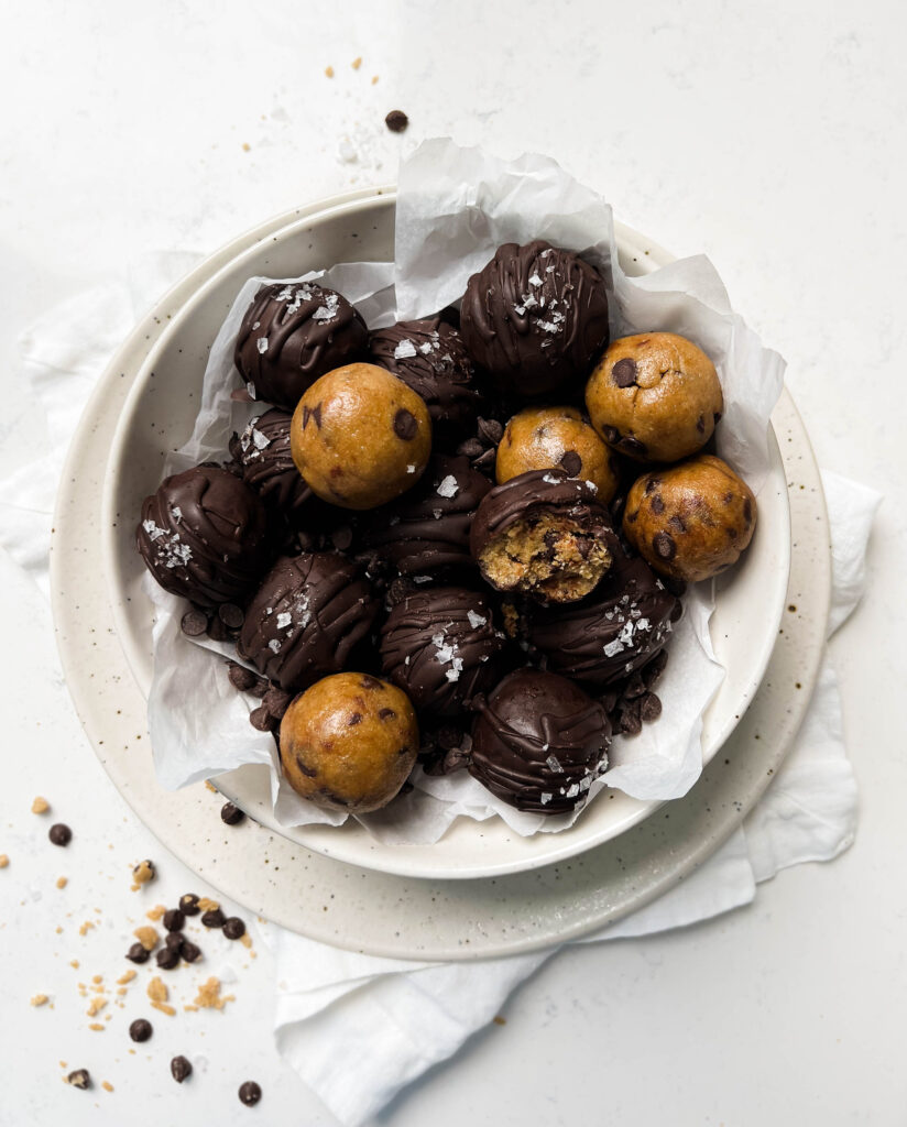 cookie dough in a white bowl on a linen cloth