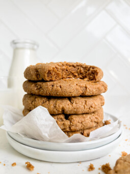 chewy vegan chai cookies stacked on top of a white plate