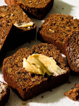 slices of vegan banana bread on parchment paper