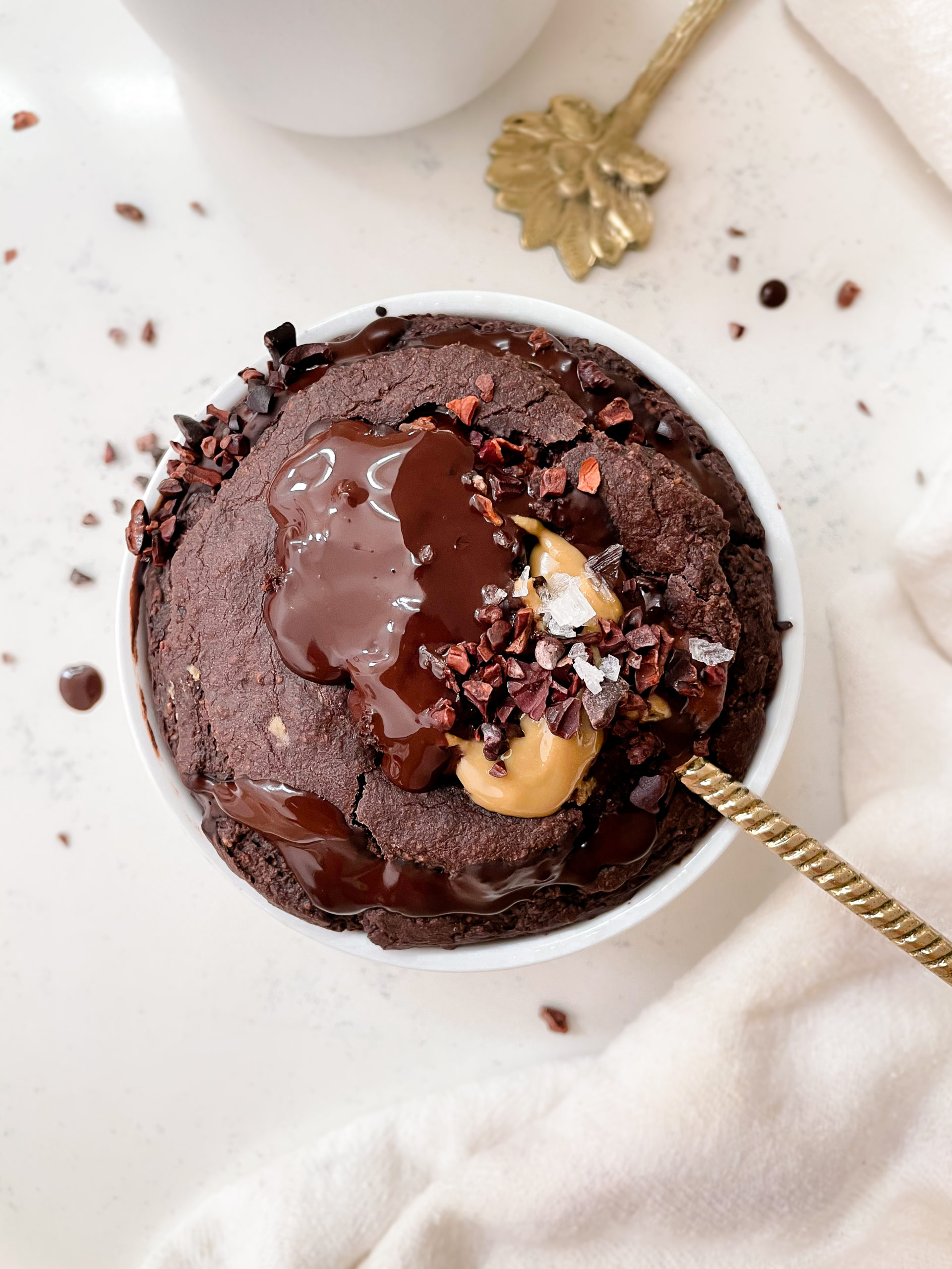 peanut butter cup baked oatmeal stuffed with peanut butter and chocolate and topped with flaky salt