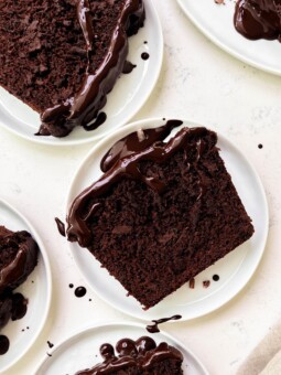 chocolate zucchini bread slices on white plates