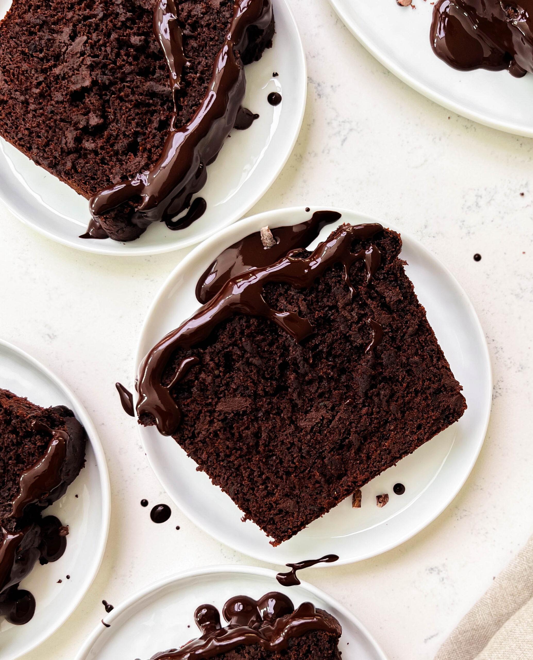 chocolate zucchini bread slices on white plates