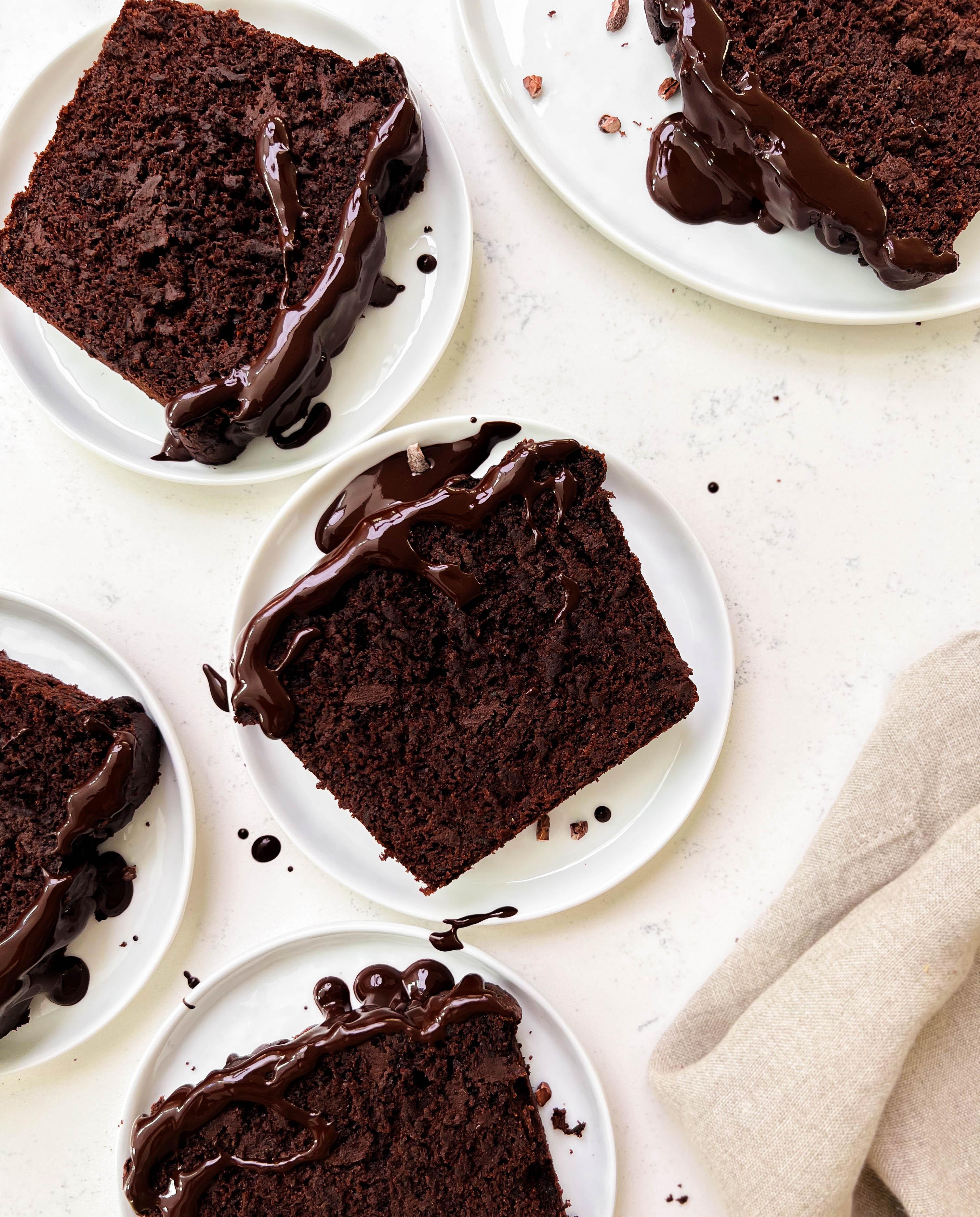 chocolate zucchini bread slices on white plates
