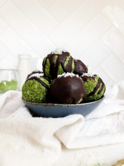green energy bites in a blue bowl