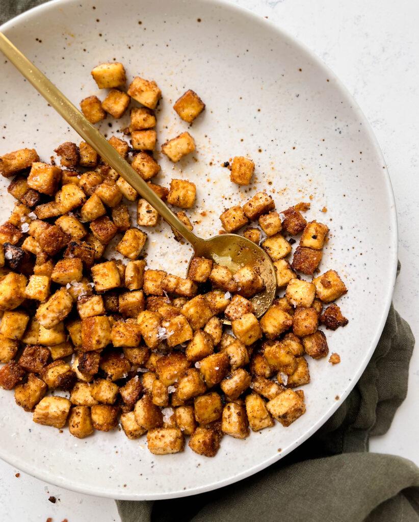 speckled plate of spicy and crispy baked tofu