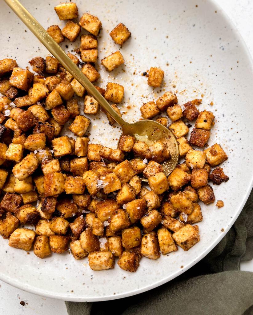 speckled plate of spicy and crispy baked tofu