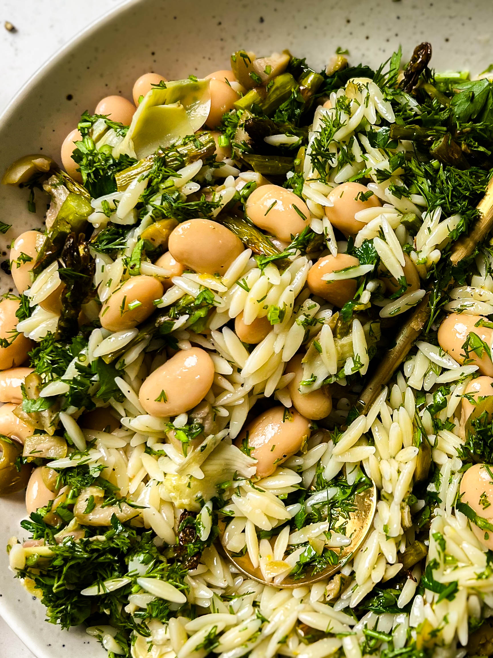 spring orzo pasta salad in a white bowl