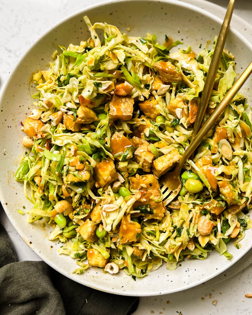 cashew crunch salad in a white bowl