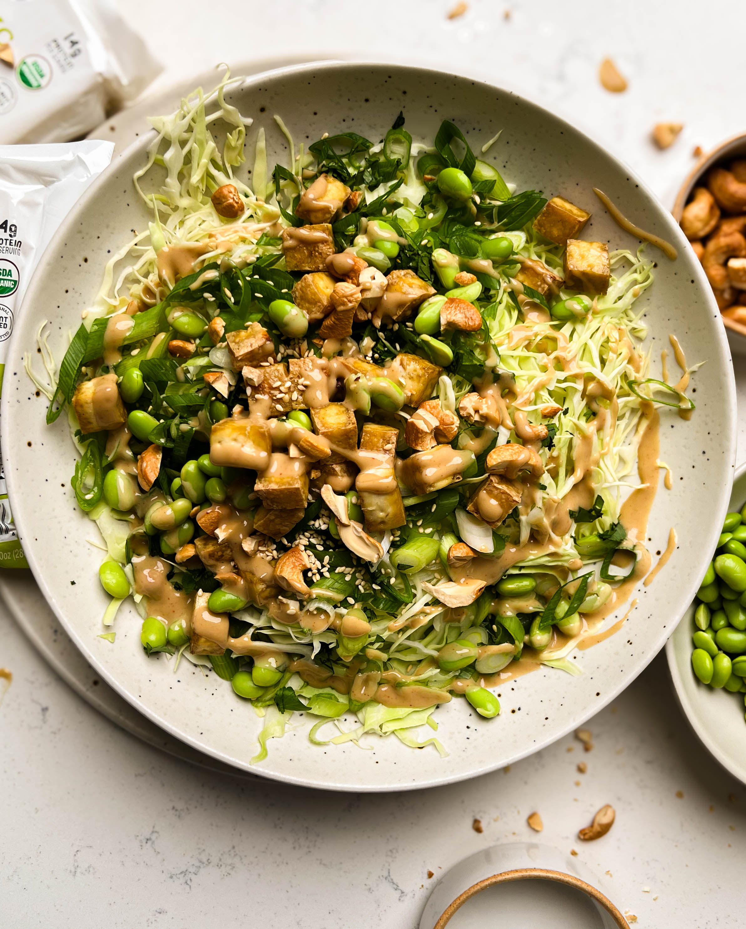 cashew crunch salad in a white bowl