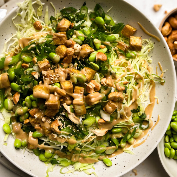 cashew crunch salad in a white bowl