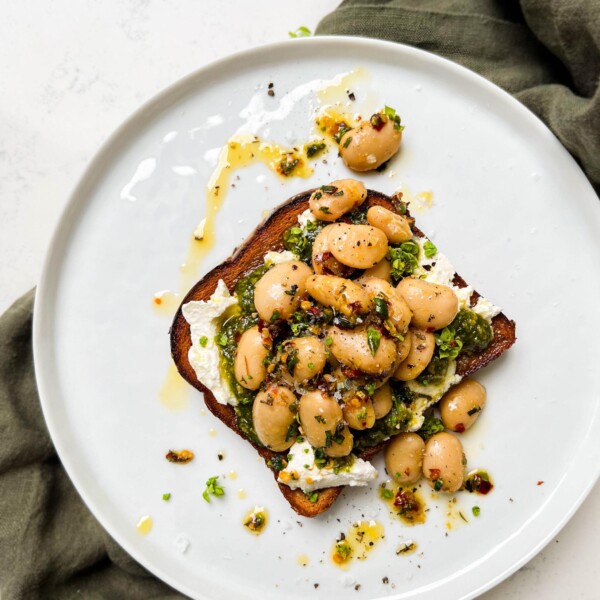 butter bean toast on a white plate