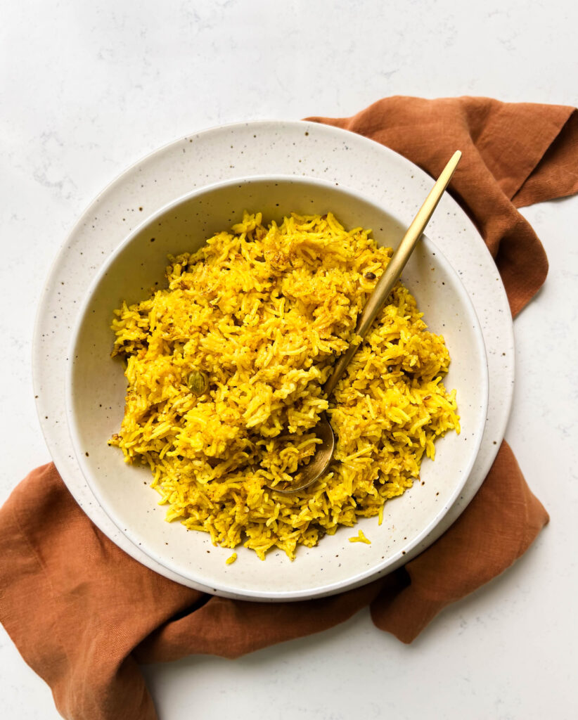 bowl of spicy rice on a brown linen cloth