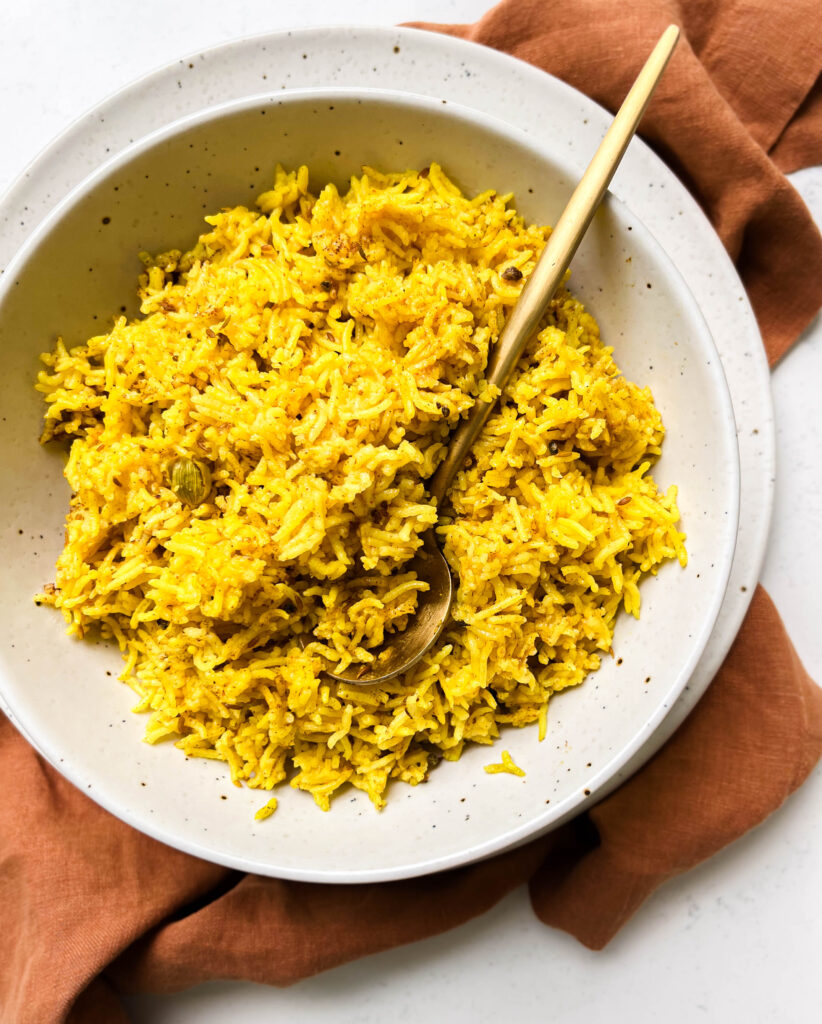bowl of spicy rice on a brown linen cloth