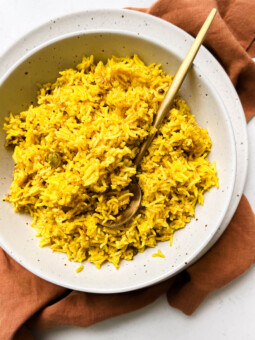 bowl of spicy rice on a brown linen cloth