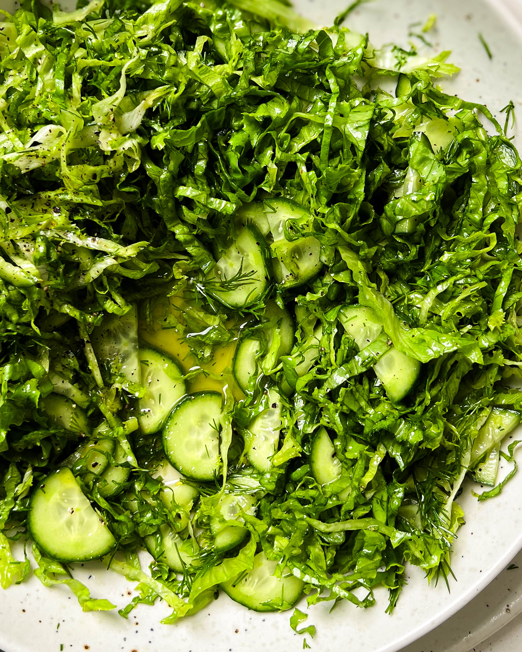 pickled cucumber salad in a white bowl