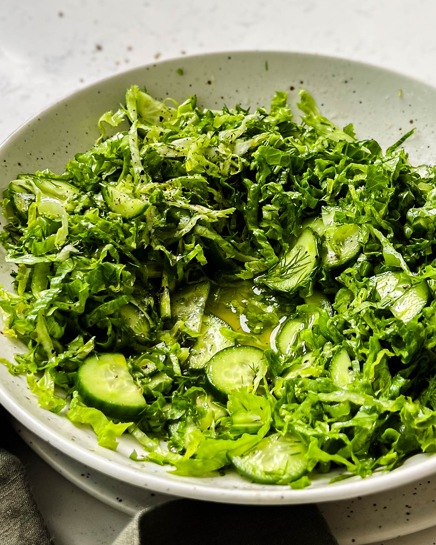 pickled cucumber salad in a white bowl