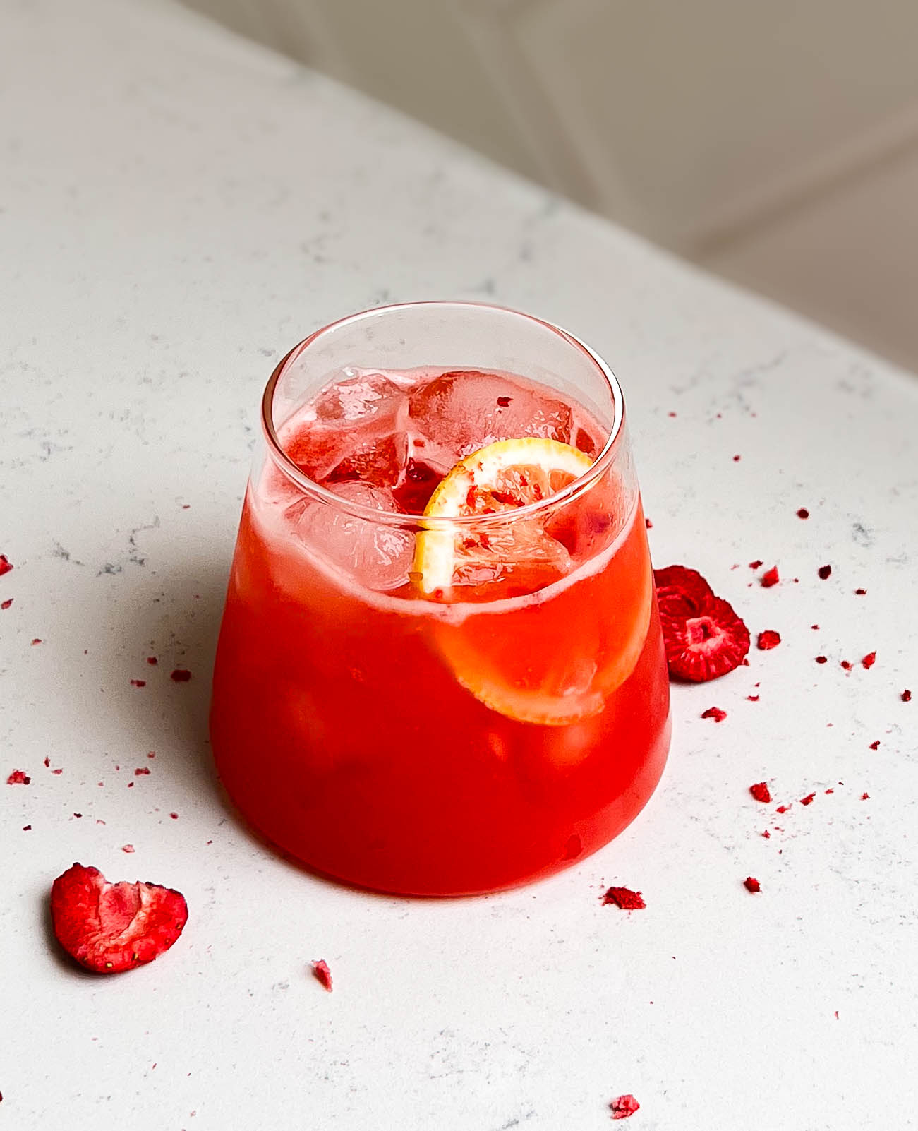summer strawberry lemonade in a triangle cup