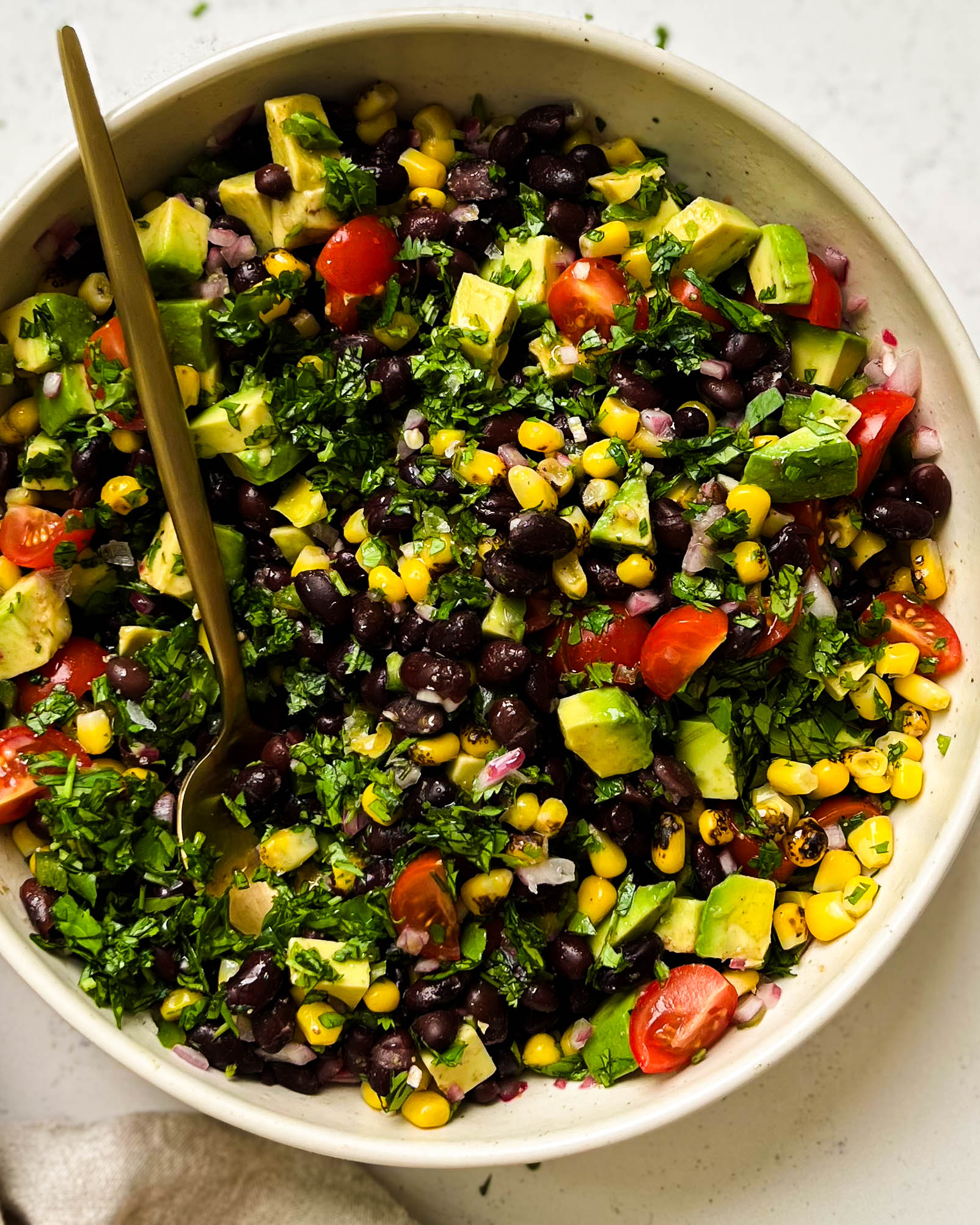 black bean salad in a beige bowl