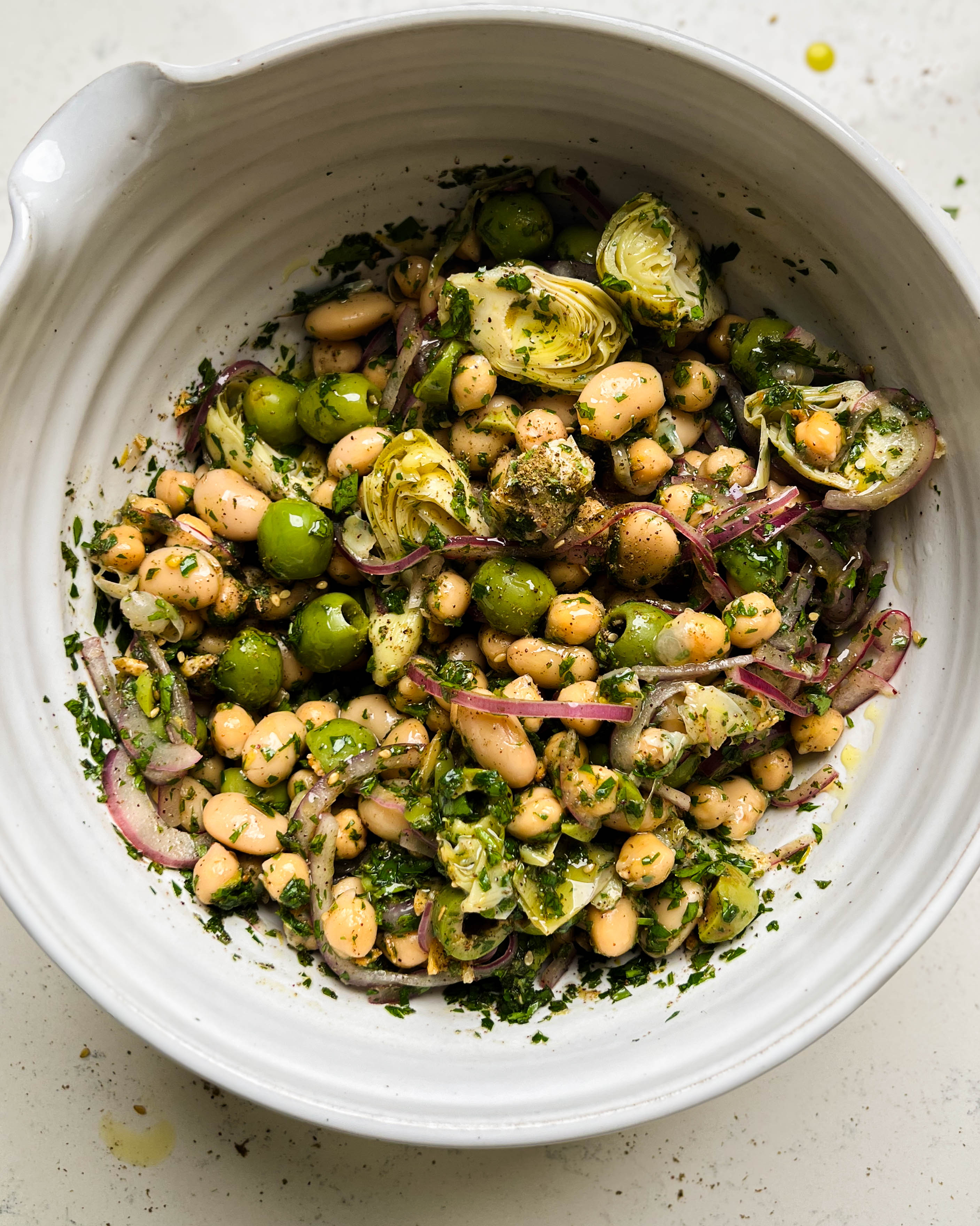 za'atar bean salad in a white bowl