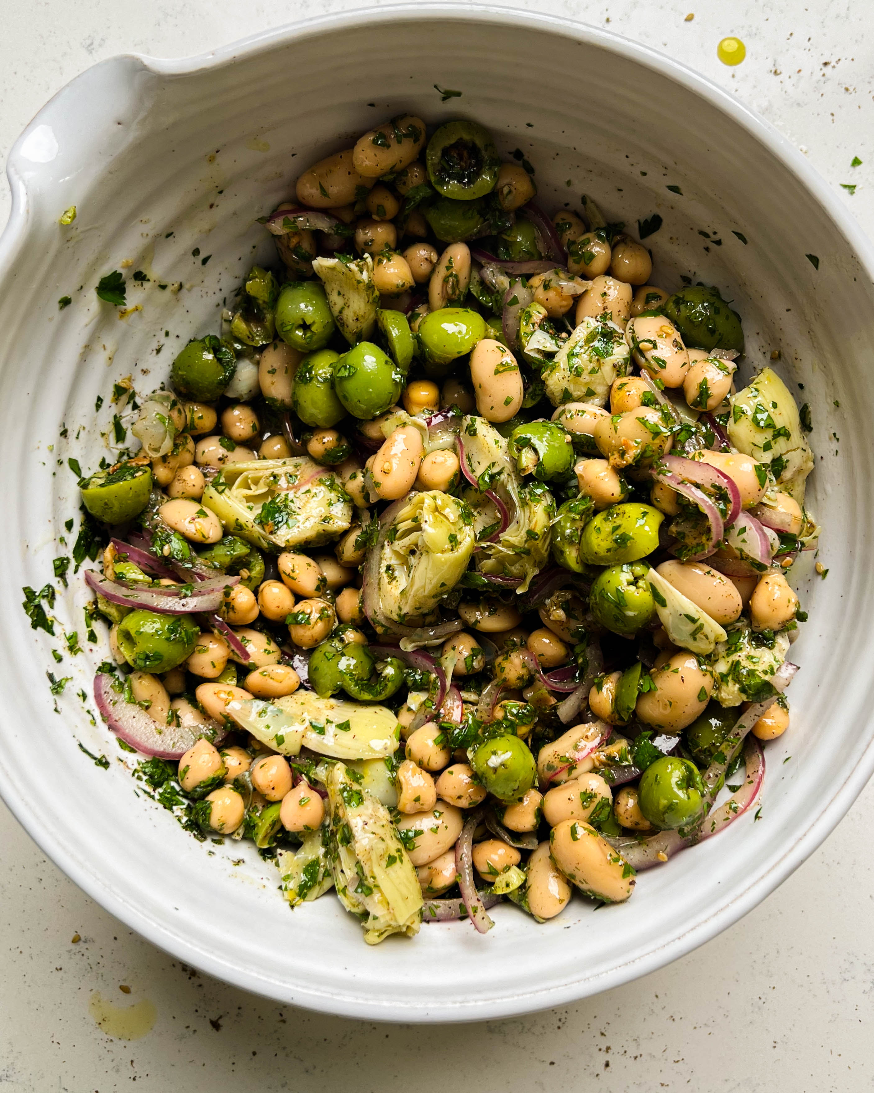 za'atar bean salad in a white bowl