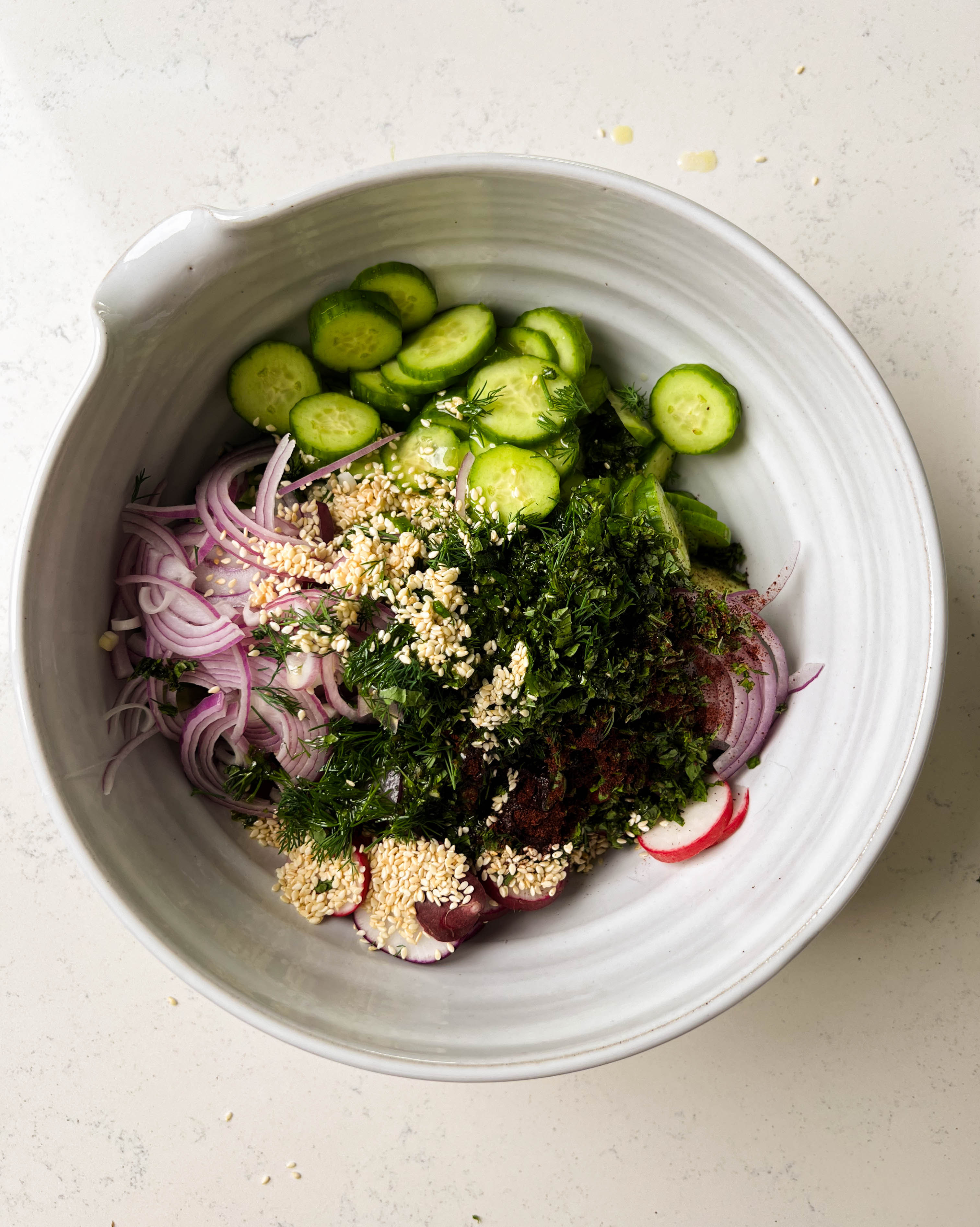 veggies and sumac in a white bowl