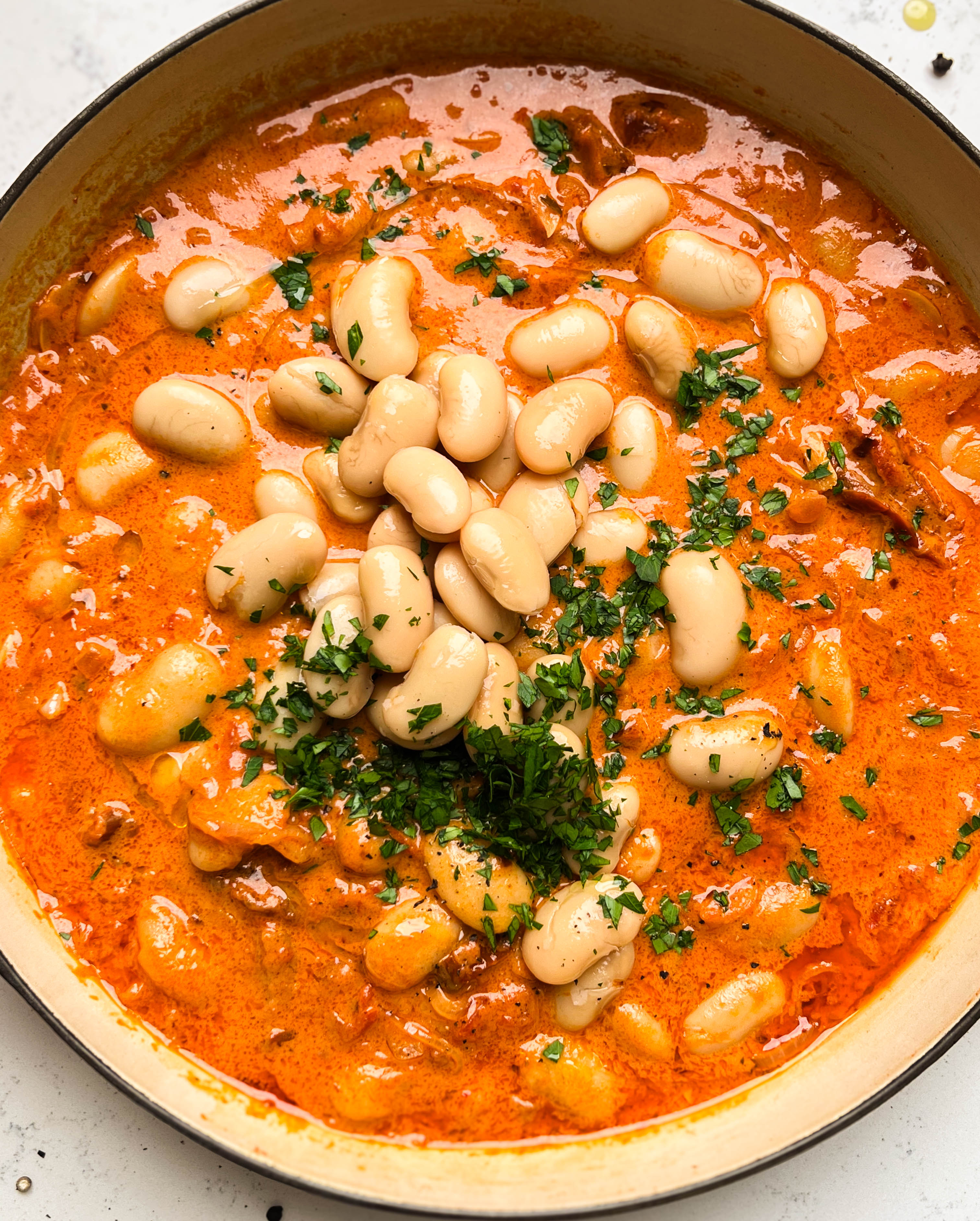 spicy tomato butter beans in a pan