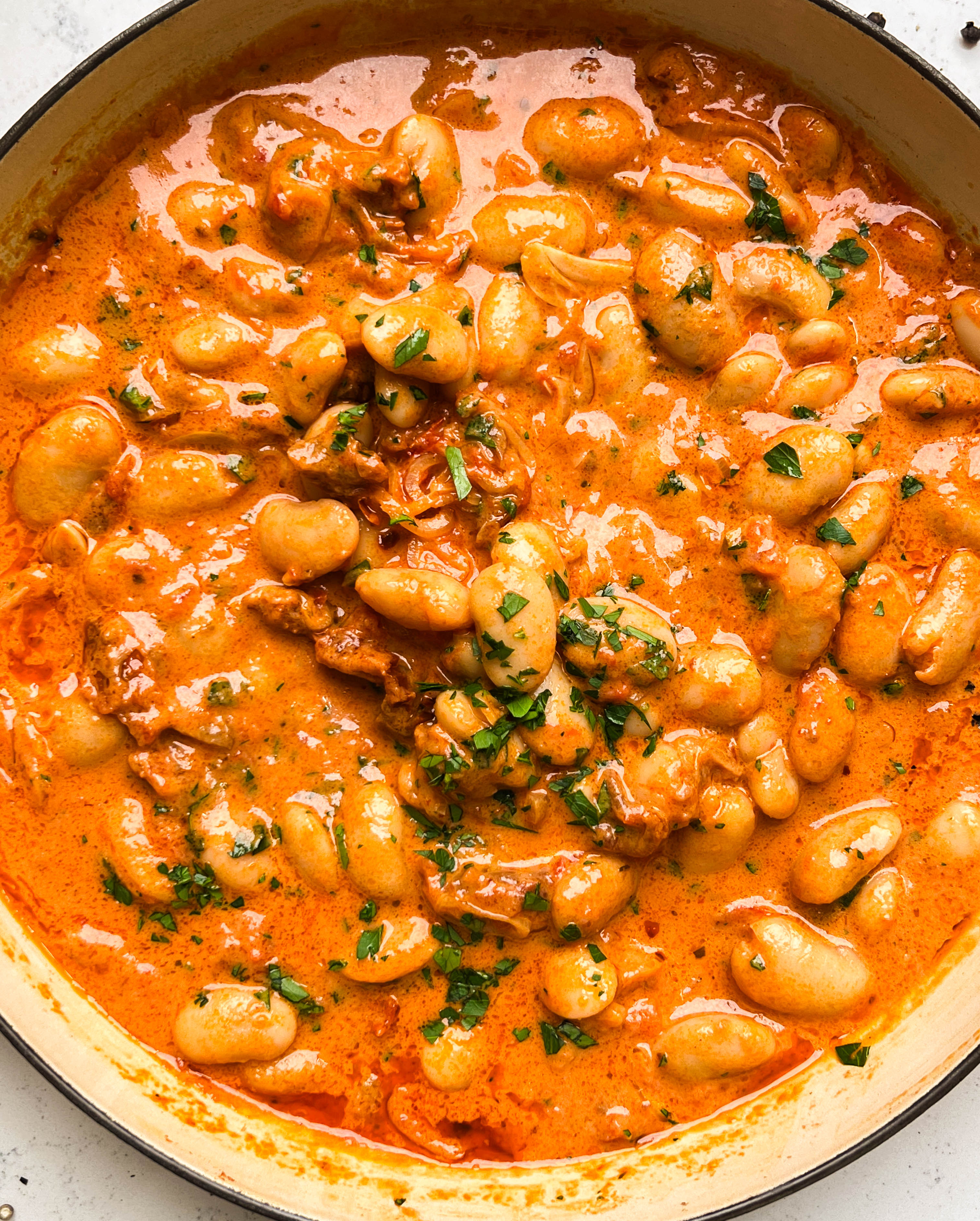 spicy tomato butter beans in a pan