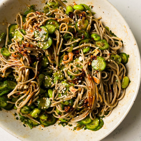 cucumber soba noodle salad in a white bowl