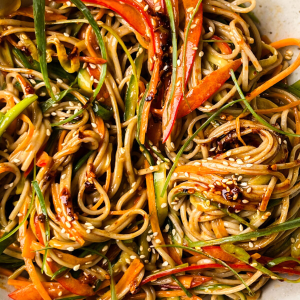 peanut soba noodle salad in a white bowl